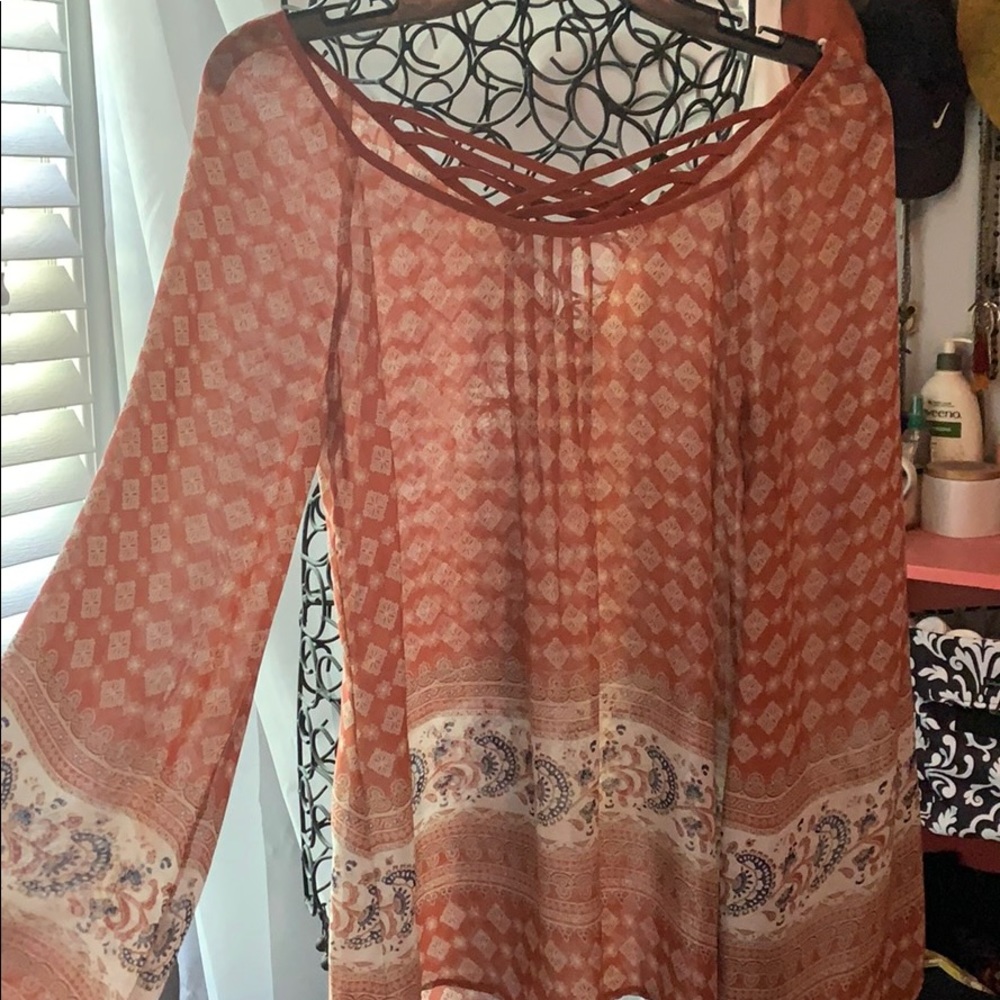 Sheer neutral colored blouse